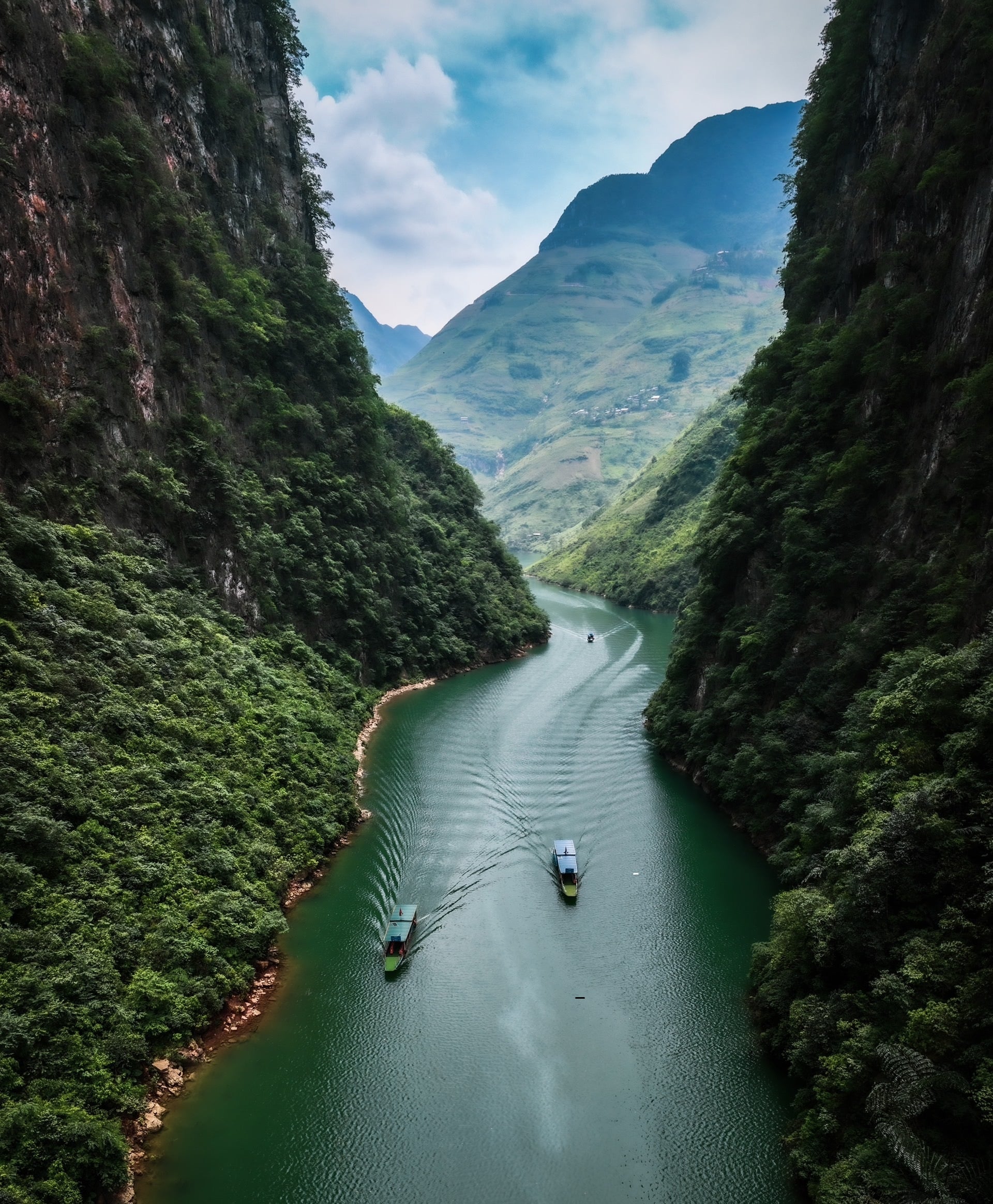 Ride along the Happiness Road and ride through the epic Ma Pi Leng Pass - Walk the Sky Path and gaze down at Tu San Canyon: the deepest gorge in Southeast Asia